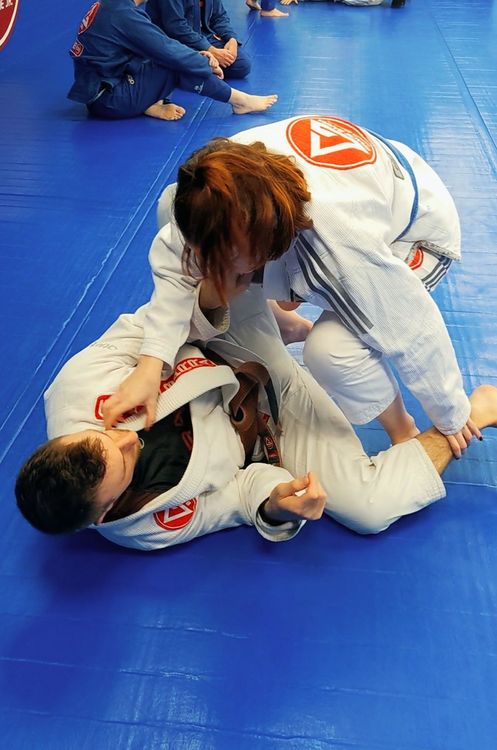 Two people practising jiu-jitsu