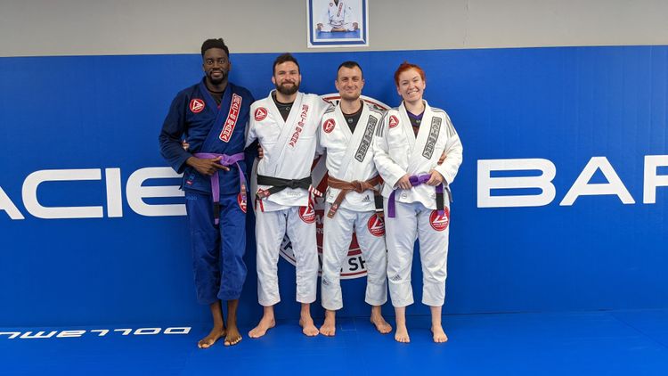 A group of people posing after a martial arts class