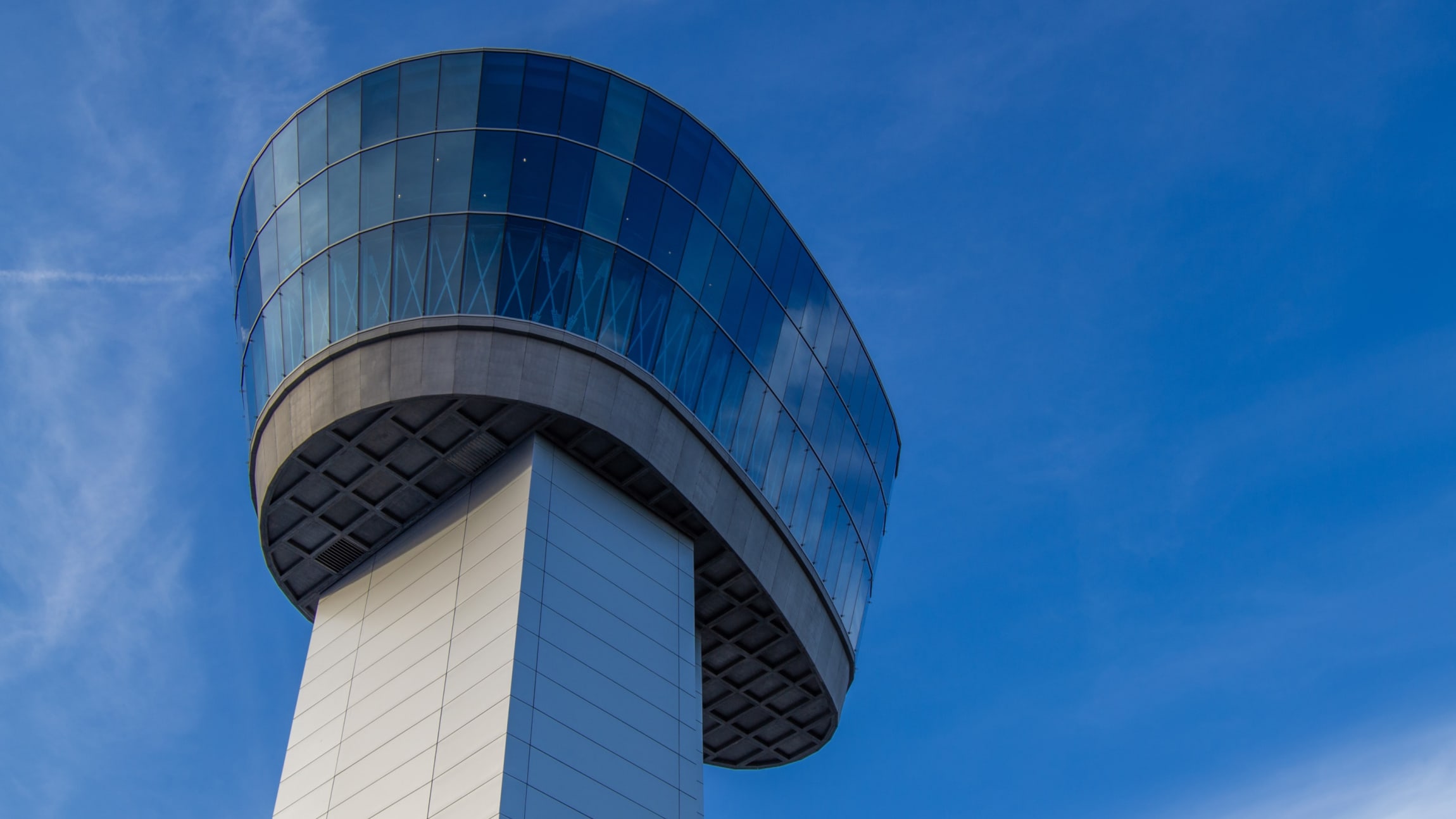 Air traffic controller station set against a blue sky.