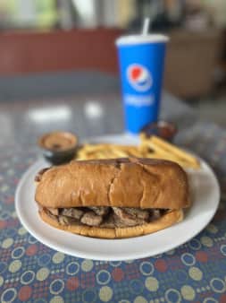 image of Tri-Tip Sandwich with Fries and a Drink