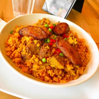 image of #12 Chunks Pork with Yellow Rice/Arroz con Puerco