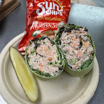 image of Tuna Salad Wrap with a bag of Chips!! And a pickle spear!! 