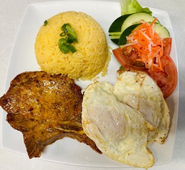 image of R04. Grilled Pork Chop W/2 Eggs W/Butter Rice
