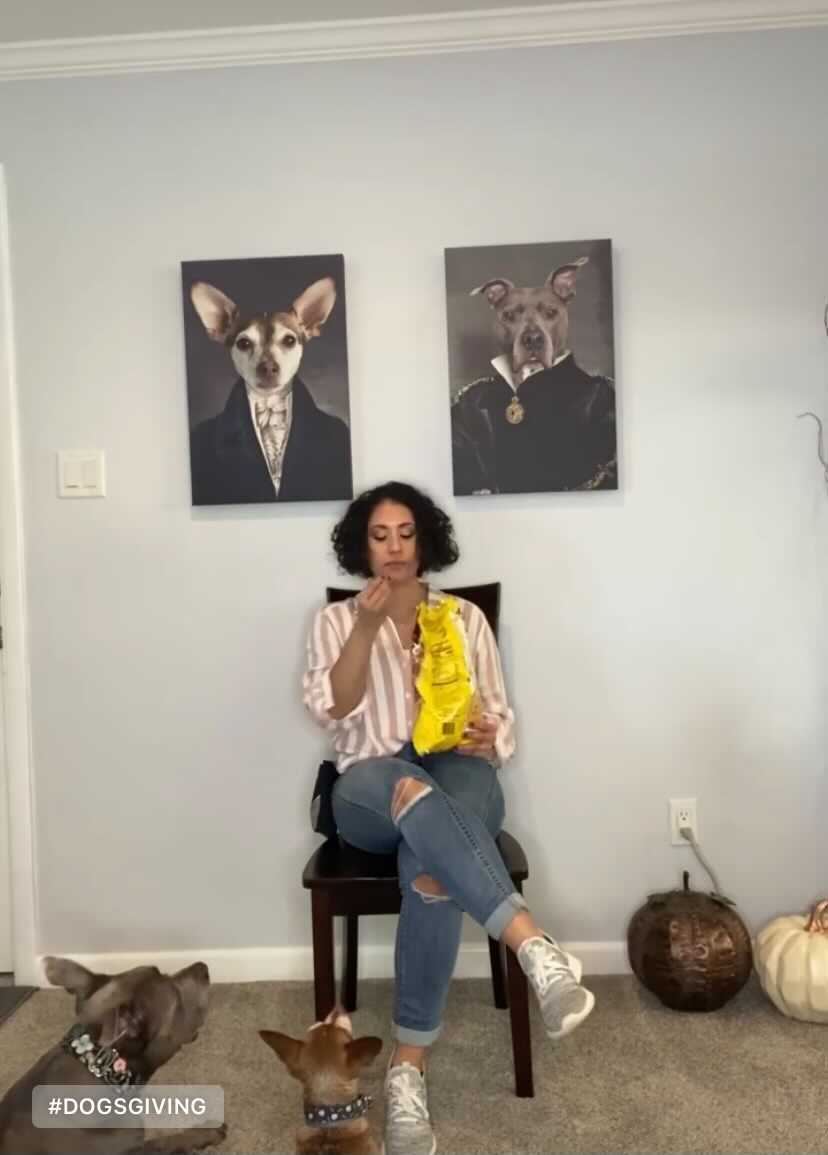 erika dog trainer sitting in front of dogs with food