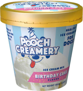 A small tub of dog-safe ice cream mix in birthday cake flavor