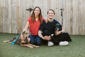 A dog named Sugar Snap poses for a photo with his new forever family, Dr. Ritchie, Dr. Yesesky, and Fitz.