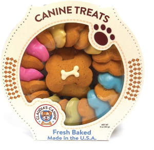 A box of bone-shaped dog treats that says "Canine treats, fresh baked, made in the USA."