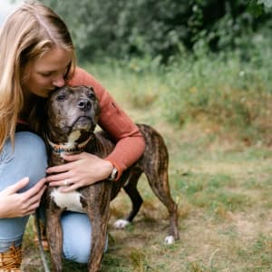 an employee out for a walk with her dog