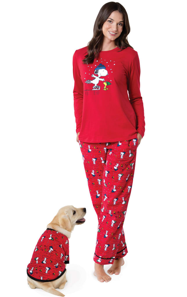 snoopy holiday pajamas woman and dog
