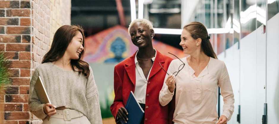 3 women walking and talking