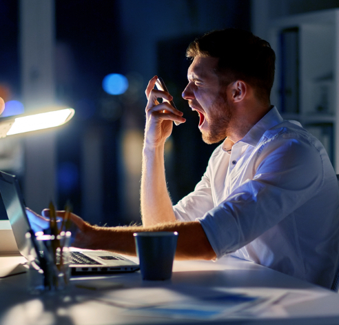 a guy yelling into a cell phone