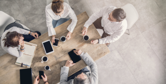 business team looking at a computer