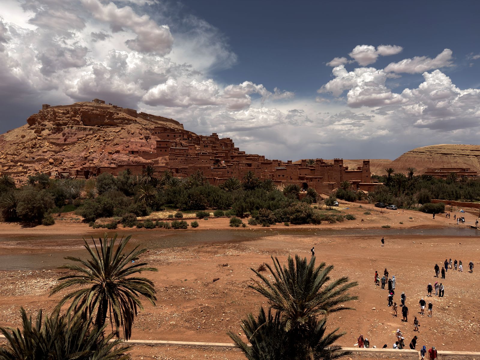 Ait Benhaddou's earthen ksar rising above palm groves near Ouarzazate