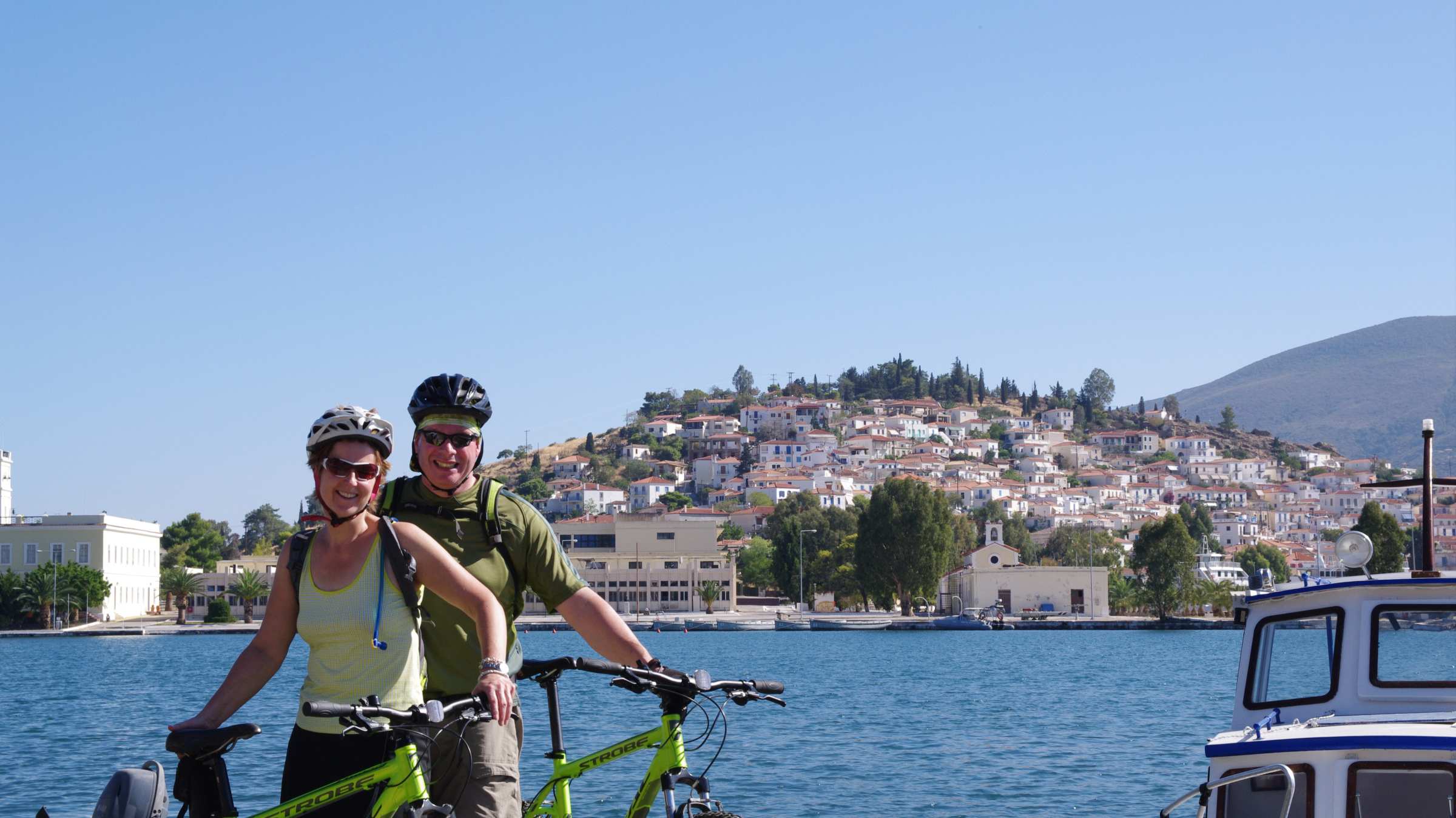 Explore Athens by bike; ferry to Poros; cycle around the island