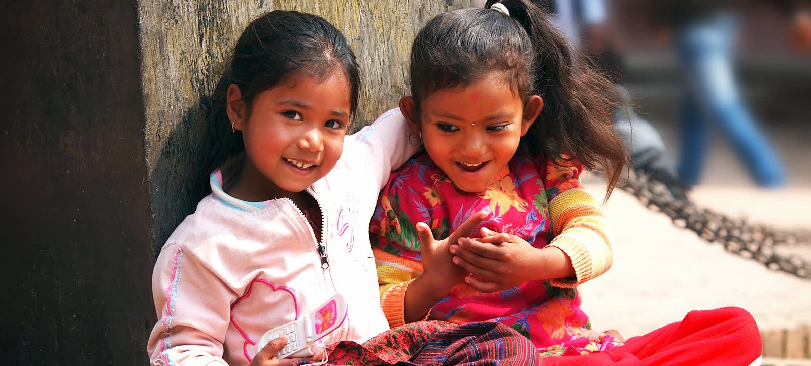 Kids sitting on the street of Kathmandu Enchanting Travels Nepal Tours