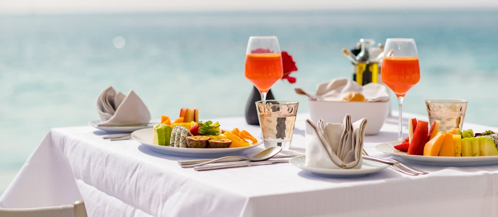 Luxury breakfast food on white table, with beautiful tropical sea view background cuisine in Maldives