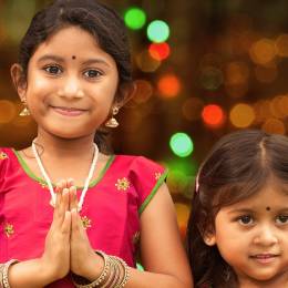 Cute Indian girls greeting you for Diwali - India travel guide