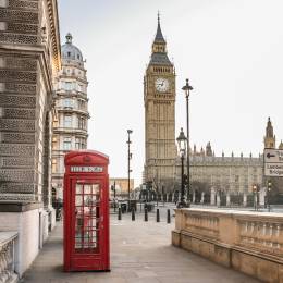 Enchanting Travels UK Ireland Tours London Big Ben tower and a red phone booth Telephone box empty streets