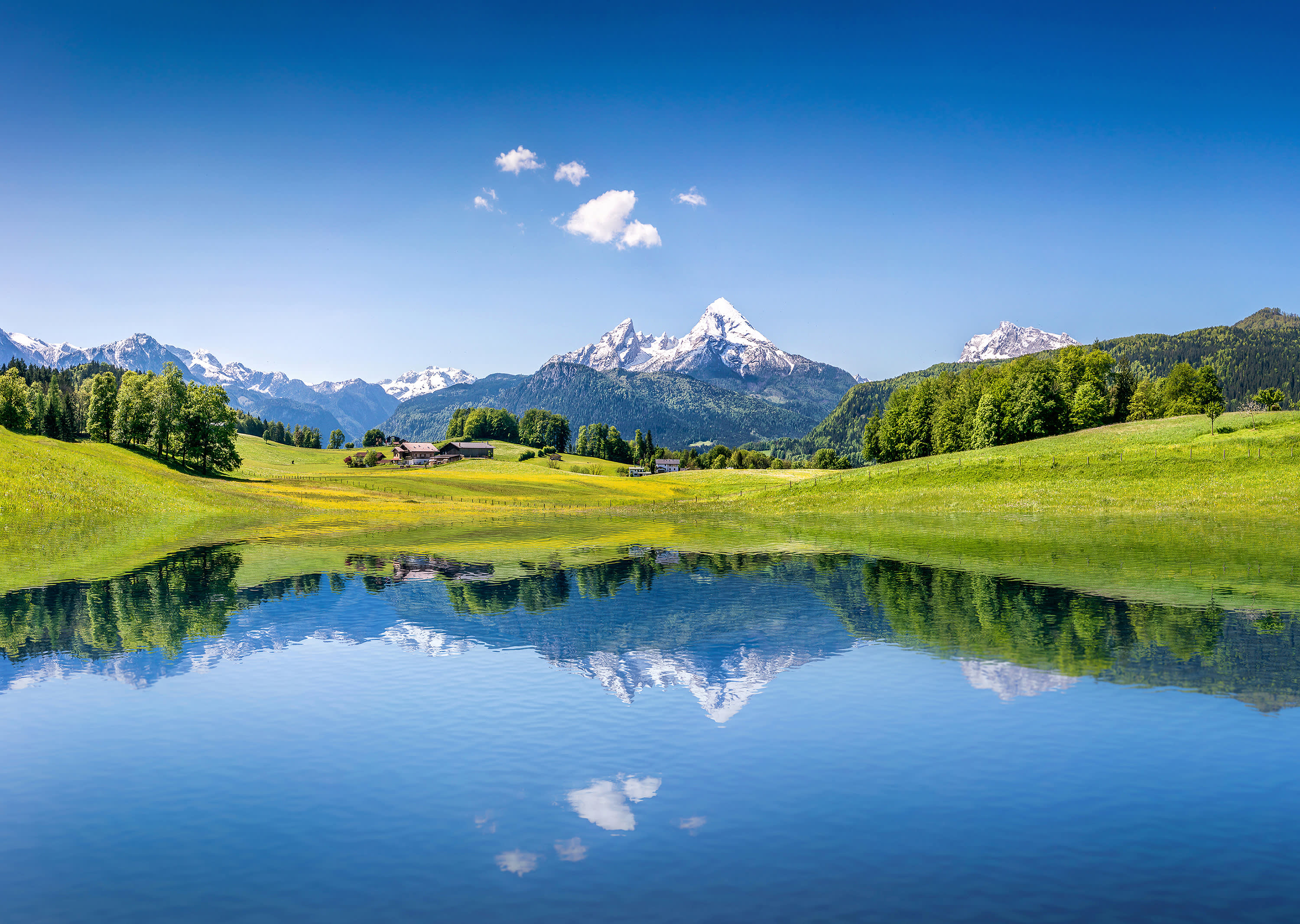Idyllic summer landscape with clear mountain lake in the Alps Best time to visit European Capitals - Idyllic summer landscape with clear mountain lake in the Alps