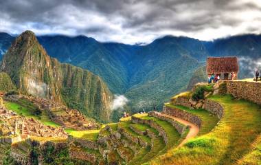 Enchanting Travels Peru Tours - Panoramic HDR image of Machu Picchu, the lost city of the Incas on a cloudy day. Machu Picchu is one of the new 7 Wonder of the Word near Cusco