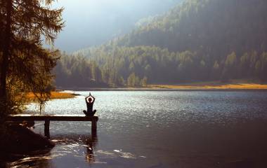 Meditation and yoga practicing at sunset