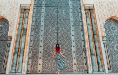 Morocco travel guide - Girls standing in front of greatest mosque Hasan II in Morocco, Africa - Top six destinations we can't wait to visit again