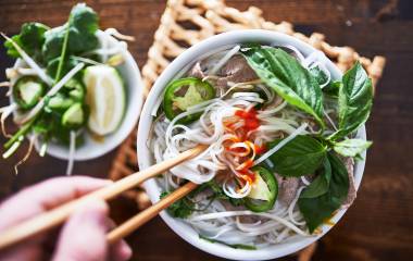 vietnamese pho with spicy sriracha sauce shot top down