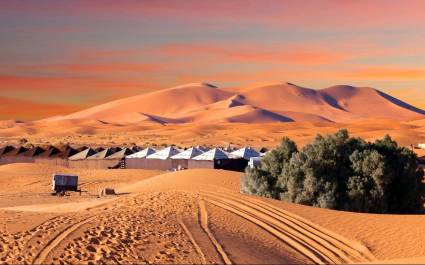 Camp site over sand dunes in Merzouga, Sahara desert, Morocco, Africa