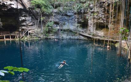 Swimmeres in X-Canche cenote in Yucatan peninsula, Mexico, Central America