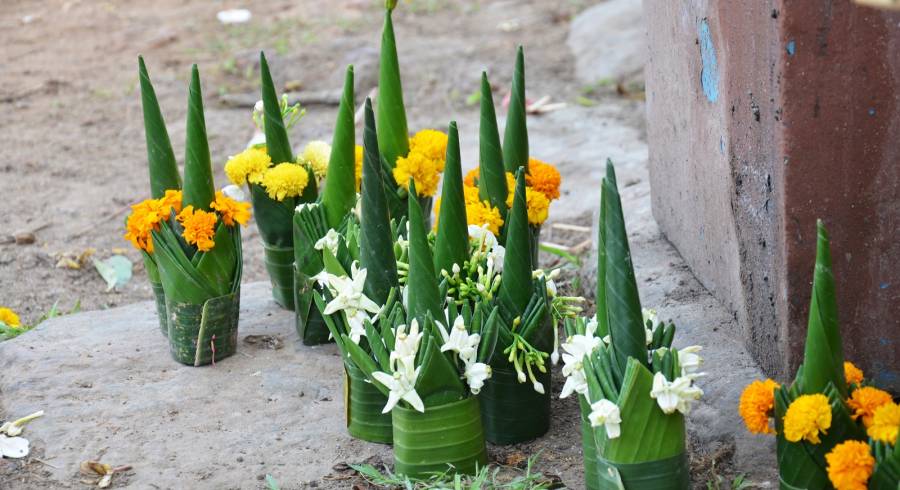 Sacrificial offering made from banana leaf and flower praying to buddha and god at Vat Phou or Wat Phu in UNESCO World Heritage Site in Pakse, Champasak, Laos.