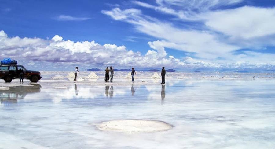 Bolivia -  Uyuni-Salt flats in rain with car