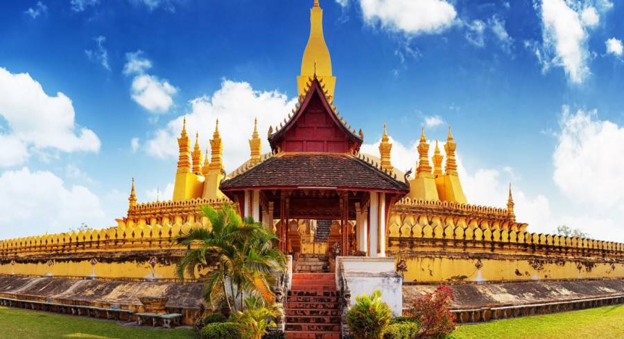 Enchanting Travels Laos Tours golden pagoda wat Phra That Luang in Vientiane.