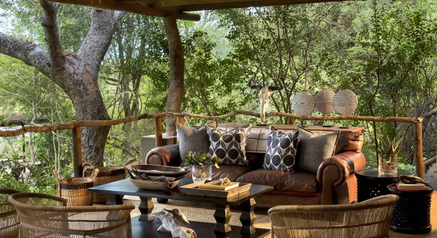 Outdoor lounge area at Lion Sands Tinga Lodge Hotel, South Kruger in South Africa
