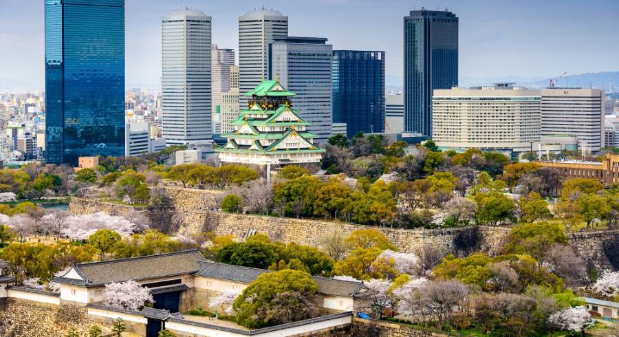 Osaka, Japan city skyline at the castle and business park in the spring.