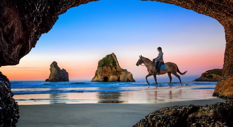 Enchanting Travels New Zealand tours view from the cave of Wharariki Beach