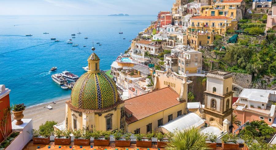 Enchanting Travels Italy Tours Beautiful Positano on hills leading down to coast