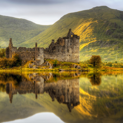 Enchanting Travels Europe Tours Kilchurn Castle reflections in Loch Awe at sunset, Scotland