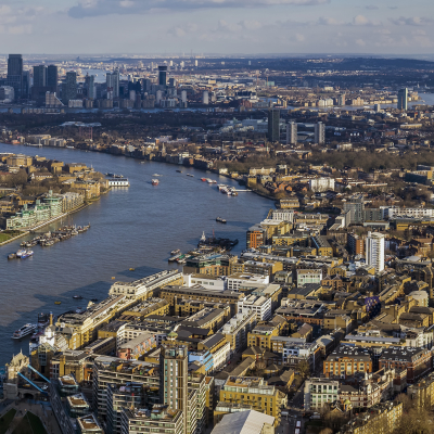 London aerial skyline view, Tower Bridge with Double Decker Bus, the City Hall, skyscrapers of Canary Wharf