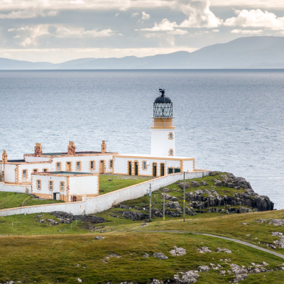 Lighthouse on the cliffs of Neist Point, a famous landmark near Glendale, Isle of Skye, Scotland, Europe