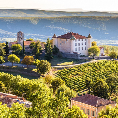 View Of Aiguines Village And Renaissance-style Chateau Overlooking Lac de Sainte Croix Lake-Alpes de Haute Provence, France