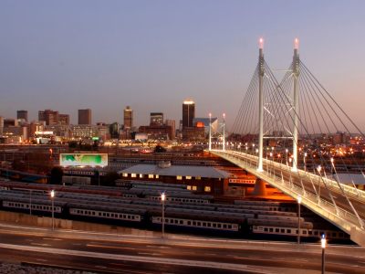 a large long train on a bridge