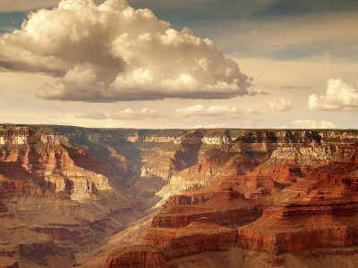 a group of clouds in a canyon