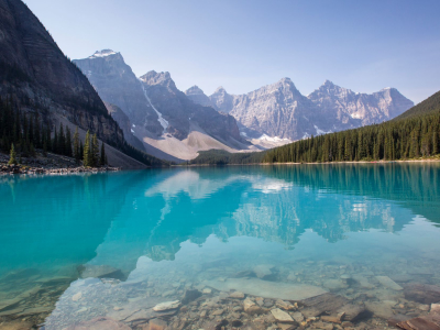 a body of water with a mountain in the background