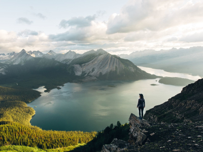a group of people standing on the side of a mountain