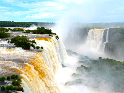 a large waterfall over some water with Iguazu Falls in the background