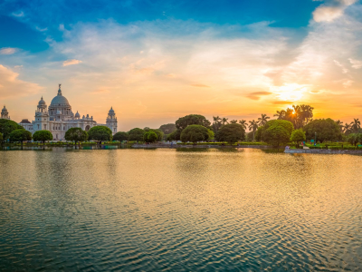 Sunset reflecting on a water body in Kolkata with Victoria Memorial in the background