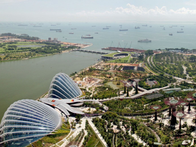 a large body of water with a city in the background