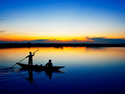 a sunset over a body of water