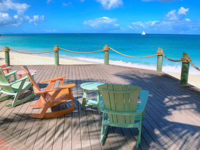 a chair sitting in front of a body of water