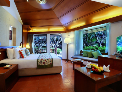 a living room filled with furniture and a large window